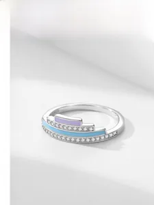 Detail of S925 sterling silver ring featuring colorful enamel bands and micro zircon inlays