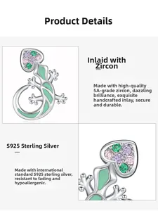 Macro detail of S925 silver lizard charm with colorful zircons and green enamel finish