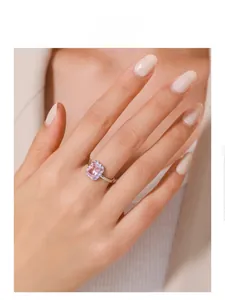 Detailed view of s925 silver ring with pink rectangular stone and lilac enamel accent