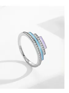 Detail macro of S925 silver ring with layered enamel accents and sparkling zircon inlay