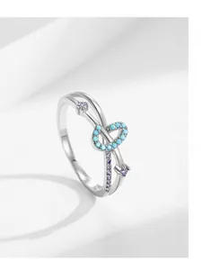 Detail of S925 silver cross ring with turquoise accents and purple zircon stones