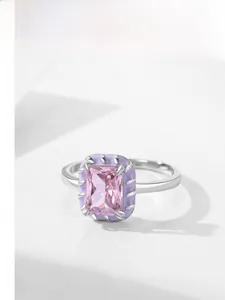 Detailed close-up of a square pink gemstone ring with purple enamel and S925 silver finish