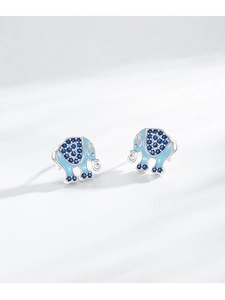 Macro shot of silver elephant stud earrings with blue enamel and sparkling zircon accents