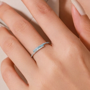 S925 sterling silver ring with micro-pave diamonds and blue enamel inlay on female finger