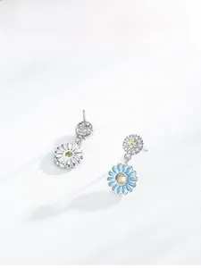 Detail of S925 silver sunflower earrings with blue enamel petals and micro-pave diamonds