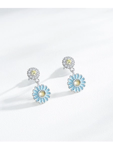 Detail of S925 silver sunflower drop earrings with blue enamel and micro-pave crystals
