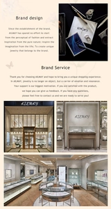Detailed sketch and physical storefront display of AILMAY jewelry design brand services
