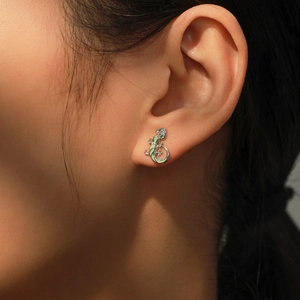 S925 silver lizard stud earring with green enamel and sparkling zircon on model ear