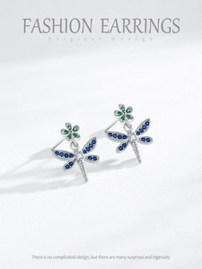 Detailed close-up of S925 silver dragonfly earrings with blue and green zircon gemstones