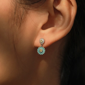 Elegant S925 silver blue enamel sunflower earrings with pavé crystals on a model
