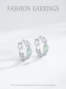 Macro detail of S925 silver hoop earrings with chain link design and colorful enamel