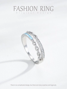 Detail of S925 silver double-layered chain ring with blue enamel and micro-pave crystals