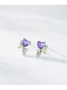 Macro shot of S925 silver heart stud earrings with purple gemstone and micro-pave details