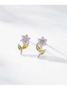 Macro shot of S925 silver flower earrings with pink and yellow rainbow zircons