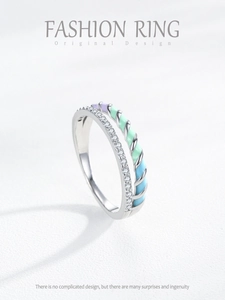 Macro detail of double-layer ring with sparkling micro-pave diamonds and colorful enamel