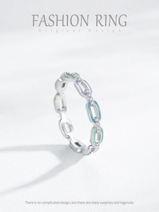 Macro shot of S925 silver chain ring with colorful enamel inlay and sparkling zirconia