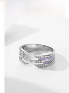 Macro shot of S925 silver layered claw ring with purple enamel and pavé zircon stones