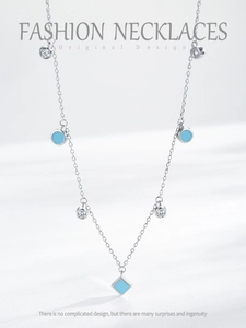 Detail of S925 silver bohemian necklace featuring blue geometric pendants and zircon stones
