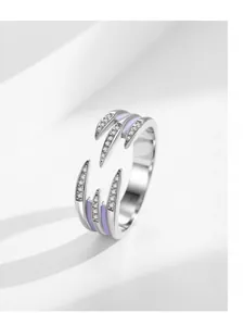 Macro detail of S925 silver ring featuring layered claw design with purple enamel and zircons