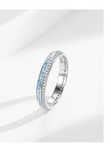 Detail of S925 silver ring featuring blue meander enamel and micro-pave zirconia