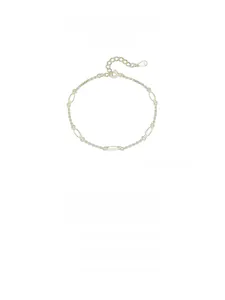 Detailed macro view of S925 sterling silver gold-plated chain bracelet with oval links
