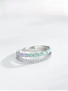 Macro shot of S925 sterling silver stamp and double-layered colorful enamel ring detail