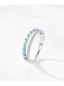 Macro detail of S925 silver double-layered ring with colorful enamel and pavé zircons