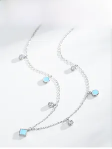 Detail of S925 silver choker with light blue geometric pendants and zircon stones