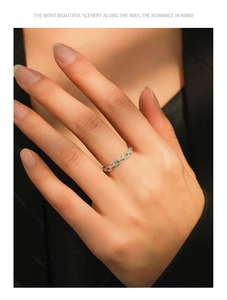 Detail of S925 silver chain ring with mint green enamel and pavé-set zircons