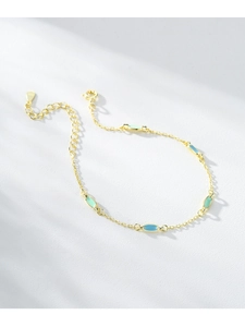 Detailed close-up of S925 sterling silver gold bracelet with colorful enamel charms