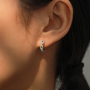 Elegant S925 silver chain hoop earrings with green enamel and clear zircon stones on model