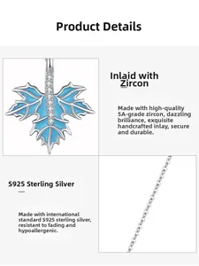 Macro details of S925 silver maple leaf pendant with blue enamel and micro-set cubic zirconia