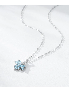 Close-up of S925 silver maple leaf pendant with blue enamel and micro-set zircons