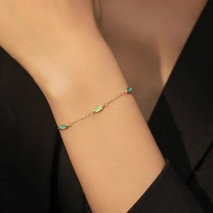S925 sterling silver gold chain bracelet with colorful enamel eye-shaped charms on wrist