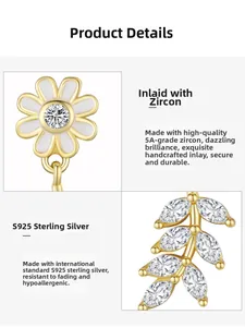 Macro shot of S925 sterling silver daisy and olive leaf charms with 5A zircon inlay