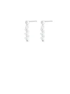 Macro detail of silver spiral drop earrings with crystal stones and cubic zirconia