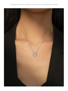 Close-up of S925 silver sunflower necklace with turquoise and zircon on model's neck
