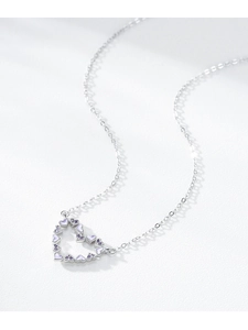 Detail of S925 silver heart pendant necklace with purple zircon stones and enamel