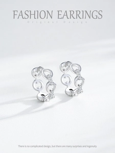 Detail of silver S925 chain earrings featuring sparkling zircon pave insets