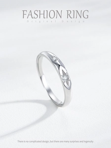 Macro detail of S925 sterling silver ring featuring starburst engraving and micro diamonds
