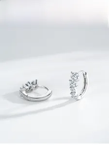 Detail view of S925 sterling silver hoop earrings featuring graduated zircon stone setting