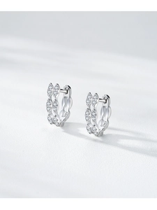 Detailed macro of S925 sterling silver hoop earrings with clear cubic zirconia stones