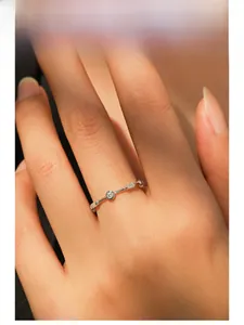 Model wearing a S925 sterling silver geometric ring with sparkling zircons