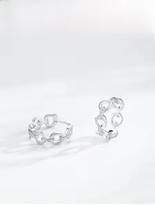Detailed macro view of S925 sterling silver chain link earrings with zircon stones