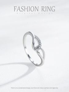 Detailed close-up of S925 sterling silver wing ring with sparkling zircon stones