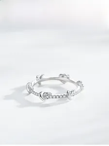 Detail of S925 silver heart ring with pavé set cubic zirconia stones for women