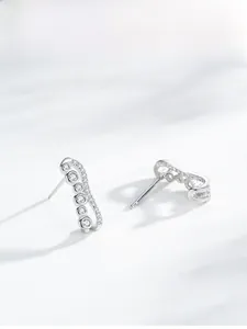 Macro shot of S925 silver bubble earrings with sparkling round-cut zircon stones