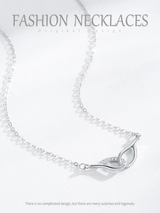 Detailed macro view of S925 sterling silver Mobius necklace with sparkling pavé zircons