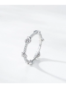 Close-up of S925 sterling silver twist ring with sparkling diamond pavé details
