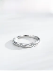 Macro detail of S925 sterling silver star ring featuring sparkling cubic zirconia stones